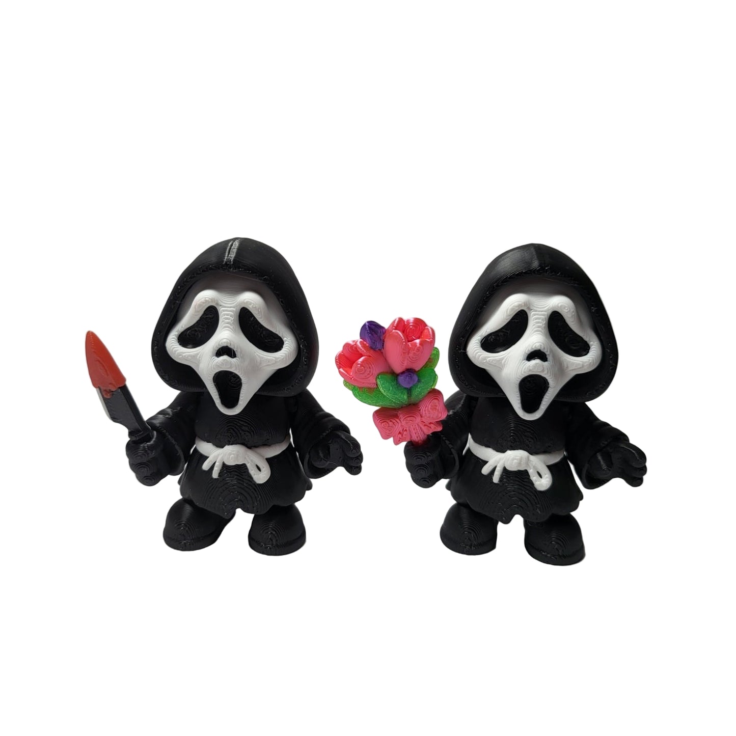 Two small figures resembling a grim reaper holding a knife and flowers on a white background